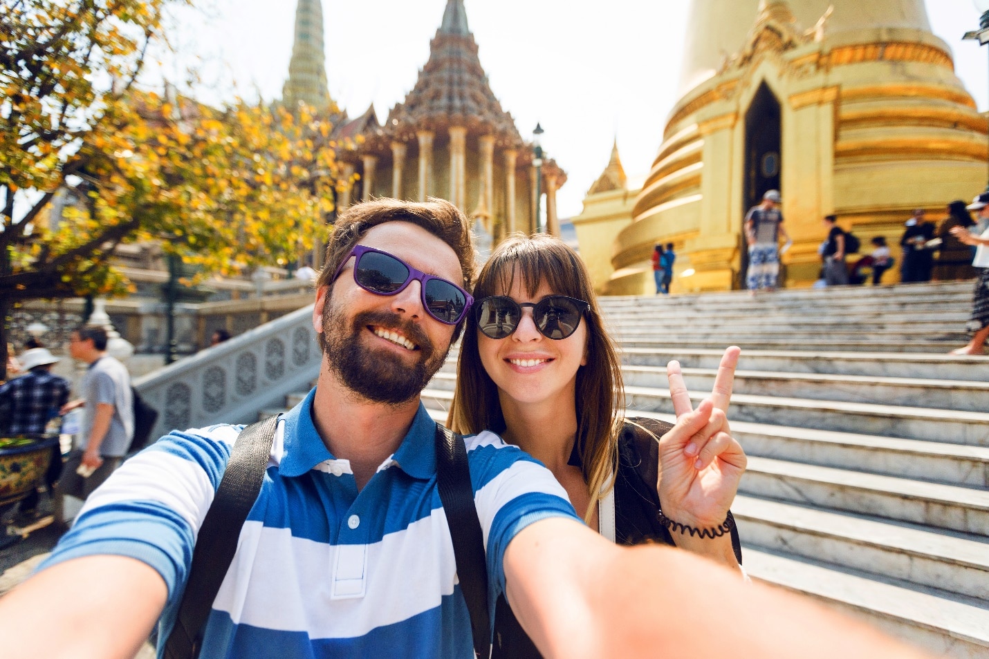 A person and person taking a selfie in front of a building

Description automatically generated