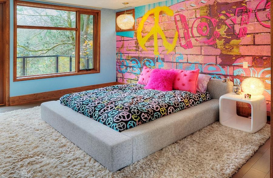 Bedroom offers a cool and eclectic look thanks to the graffiti wall