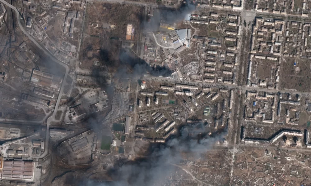 In this satellite photo from Planet Labs PBC, multiple civilian buildings burn amid Russian strikes on the Livoberezhnyi District of Mariupol, Ukraine, Sunday, March 20, 2022.