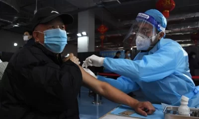 China Urges Elderly Vaccination Amid Reopening Pressure