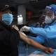China Urges Elderly Vaccination Amid Reopening Pressure