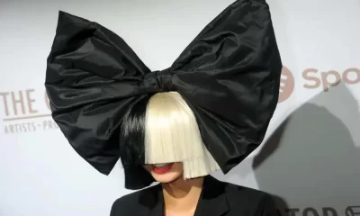 SIA Covers Her Face For What?