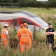 Police Officer Struck by Train While Helping Man on Tracks Dies